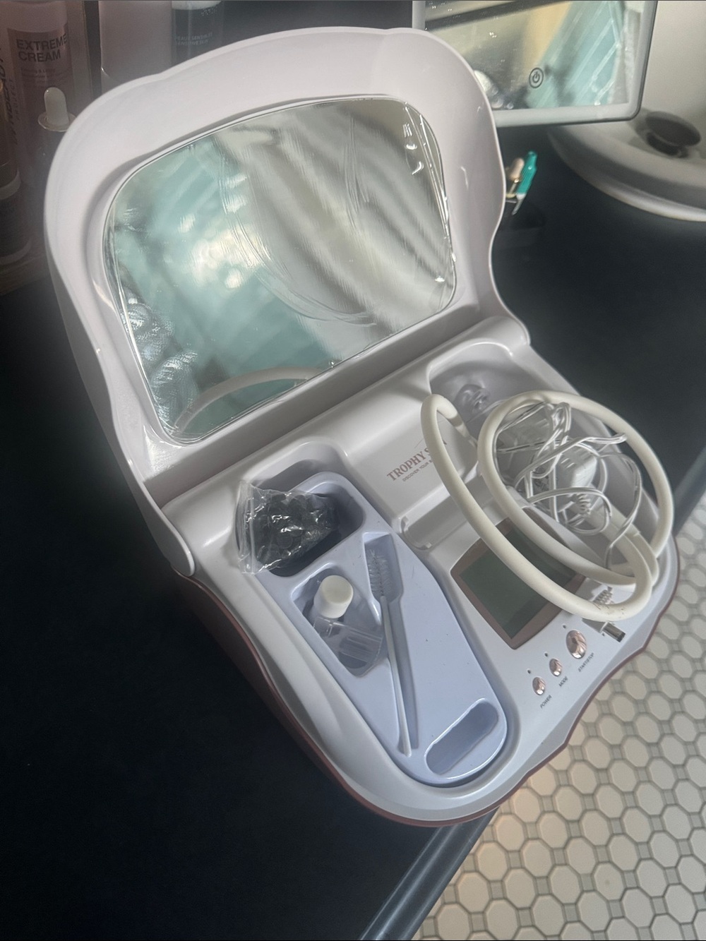 Used once- plastic still on mirror White Facial Skincare Device with Mirror
